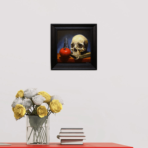 Skull on book with pomegranate