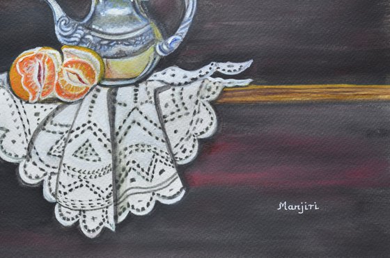 Still life with orange and teapot on lace