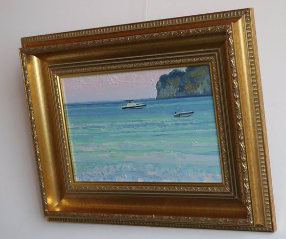 Sunset. Boats on the sea