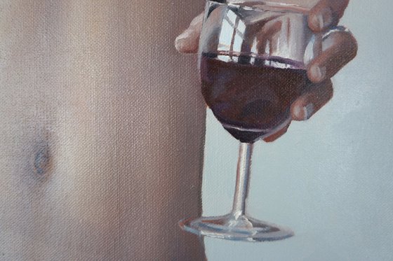 Nude with glass of wine.