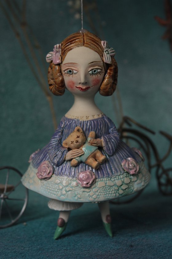 Little Girl in an blue dress with a teddy. Hanging sculpture, bell doll by Elya Yalonetski