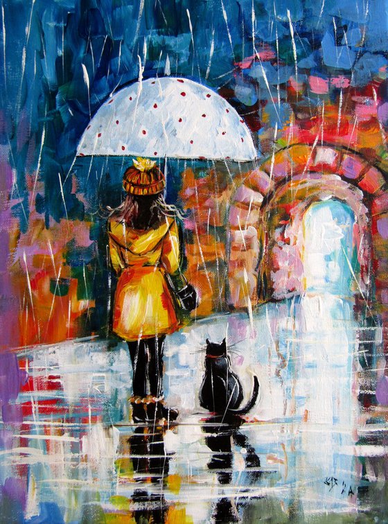 Girl with cat in the rain