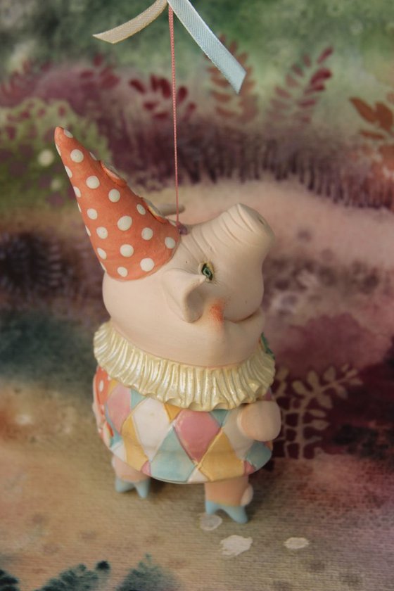 Little piggy in harlequin dress. Hanging sculpture, bell doll by Elya Yalonetski