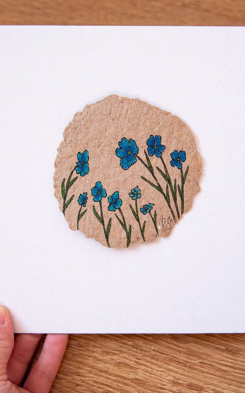 Blue flowers drawing on the author's craft paper by Rimma Savina