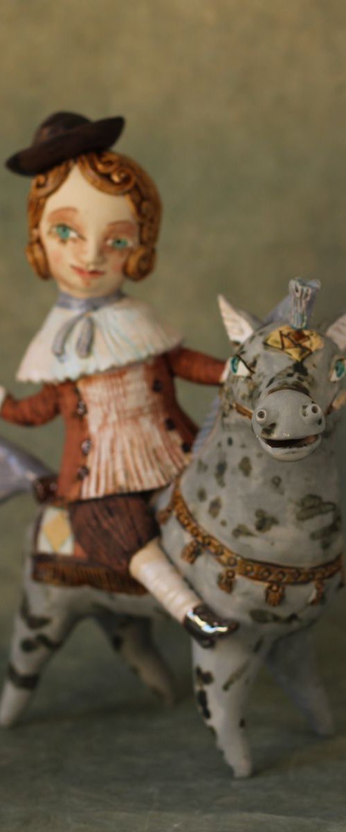 Vintage dressed boy riding the horse. From "Le Carousel, Hommage à l'Innocence" project by Elya Yalonetski by Elya Yalonetski