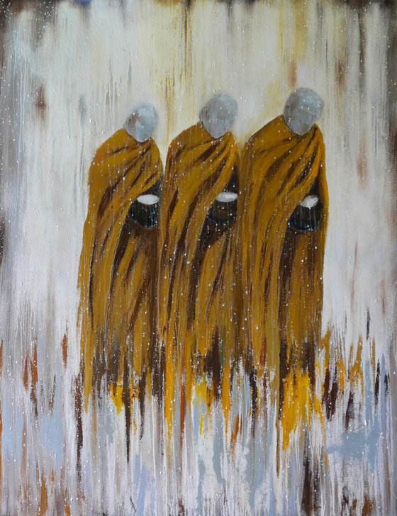 Monks walking for alms in the rain