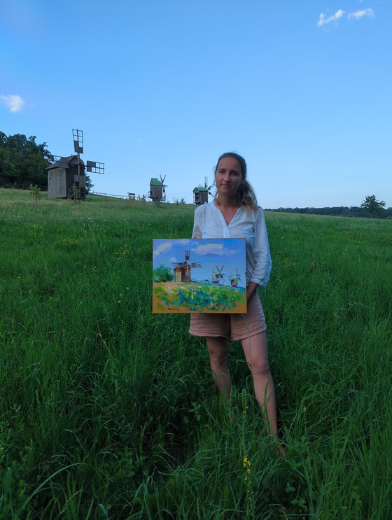 Mills in the tall grass . Summer day .  Original oil painting