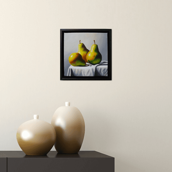 3 pears on white cloth