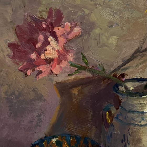 Lemons and flowers with a vase