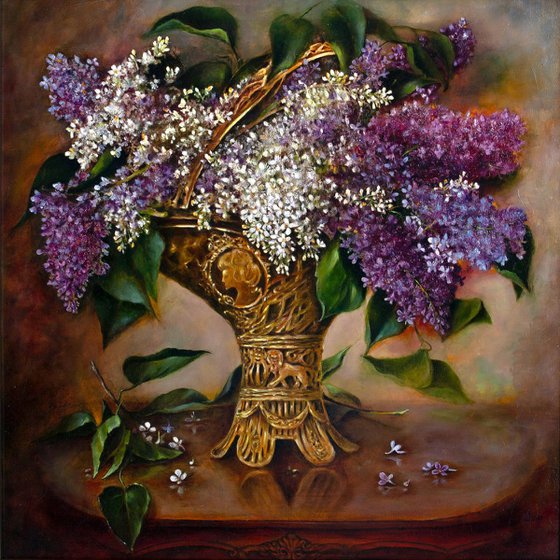 A bouquet of lilacs in a bronze vase