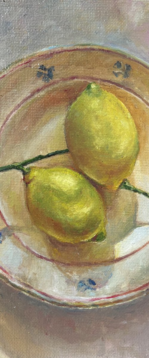 Lemons on the plate by Anastasiya Kostyuk