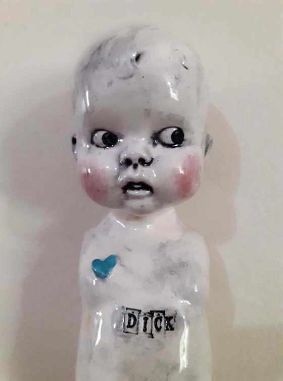 Ceramic baby doll sculpture