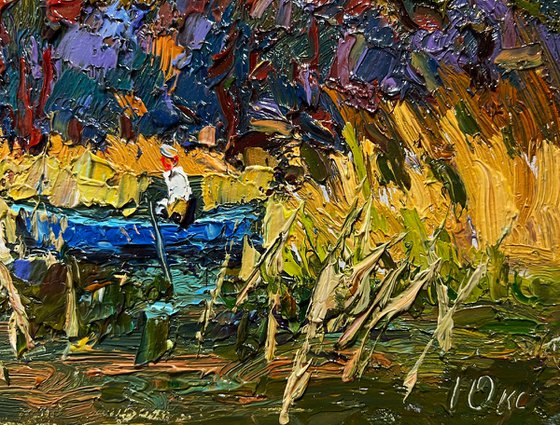 On a boat among the reeds