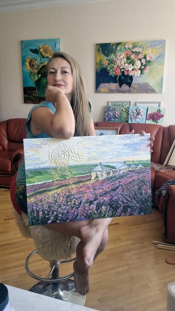 Lavender at sunset. Relief landscape with a purple field. Summer blooming
