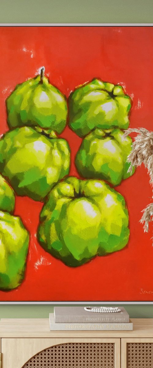 Green fruits on red background by Evgen Semenyuk