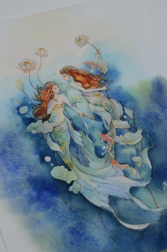 Two mermaid sisters