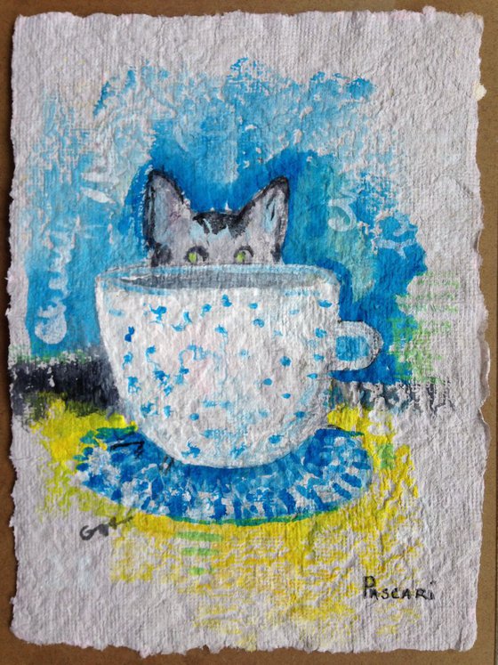 The cat with cup