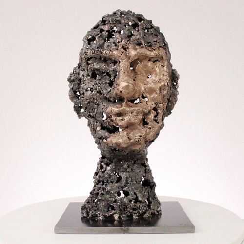 A rock - Face sculpture bronze steel by Philippe Buil