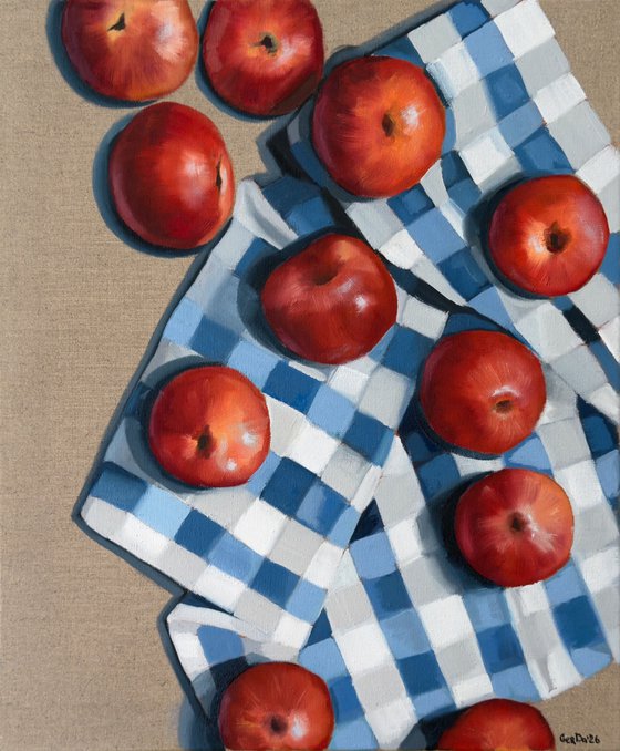 Red apples on a kitchen towel