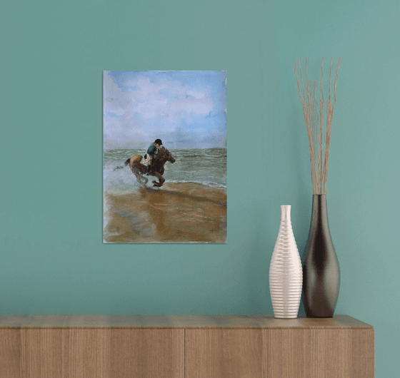 Horse riding along beach