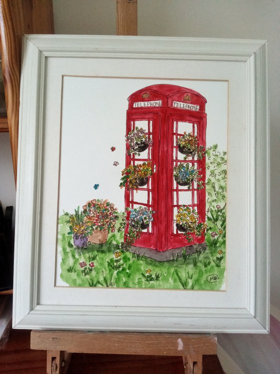 Red London Telephone box with Flowers.