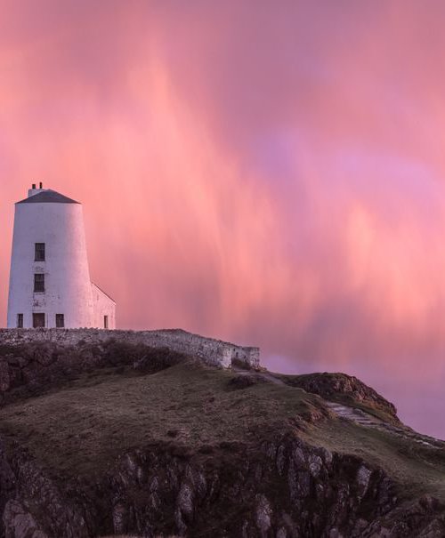 Llanddwyn Lighthouse Sunset Rainbow by Paul Nash