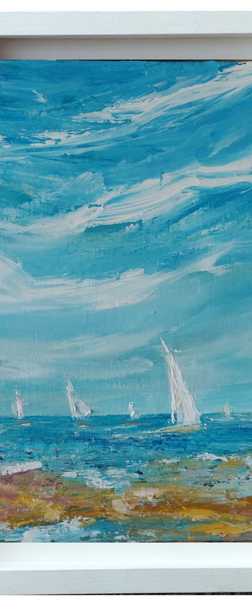 White sails on a blue day by Niki Purcell