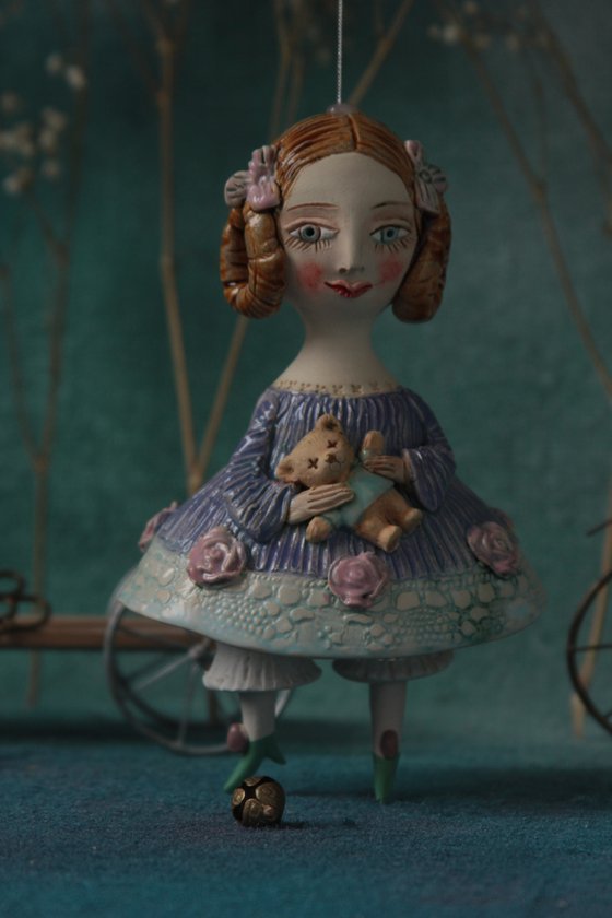 Little Girl in an blue dress with a teddy. Hanging sculpture, bell doll by Elya Yalonetski