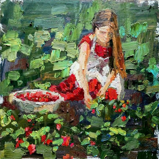 Girl picks strawberries