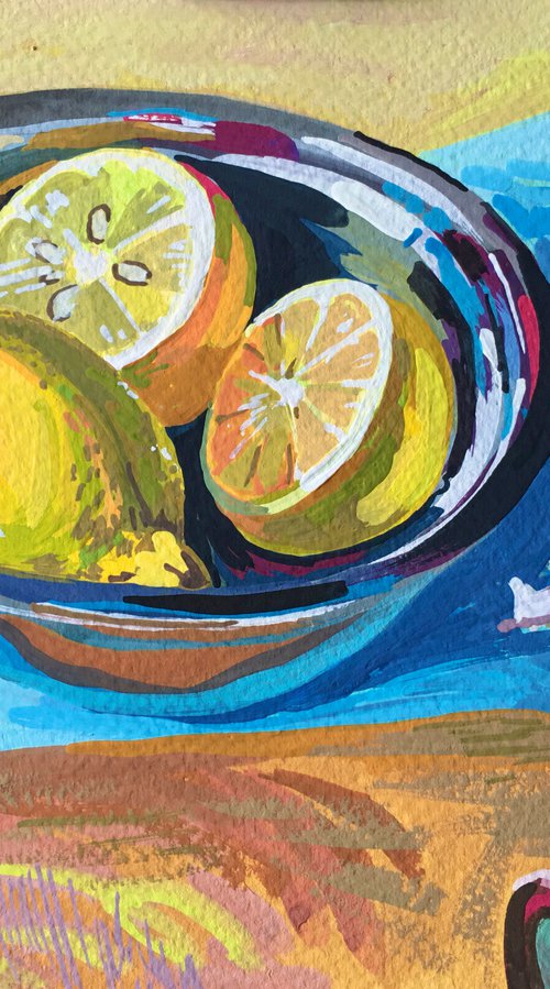 Lemons in a metal plate and purple onions by Ole Karako