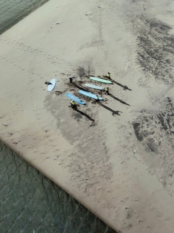 SURFERS ON THE BEACH