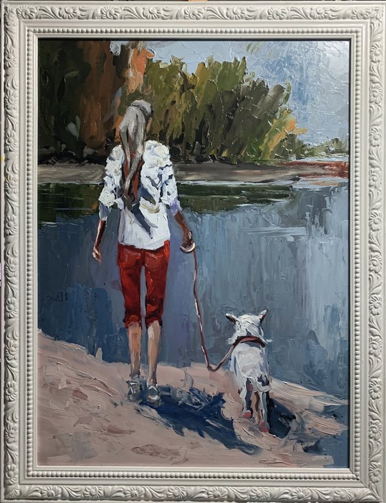 Woman walking with a dog.