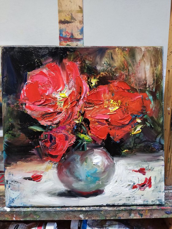 Red hibiscus in a vase
