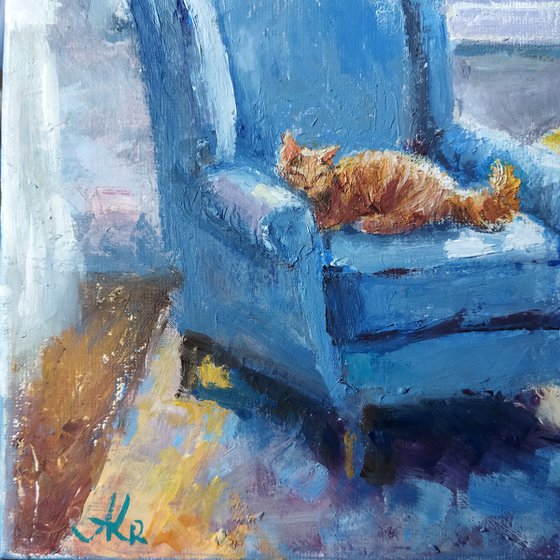 Ginger cat and armchair
