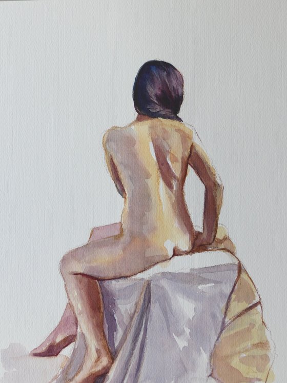 Seated female nude back view