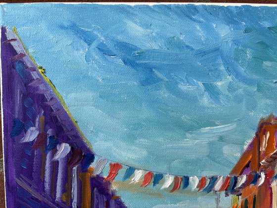 Festive Dutch town scene with cyclist