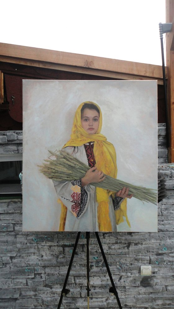 Girl with sheaves of wheat