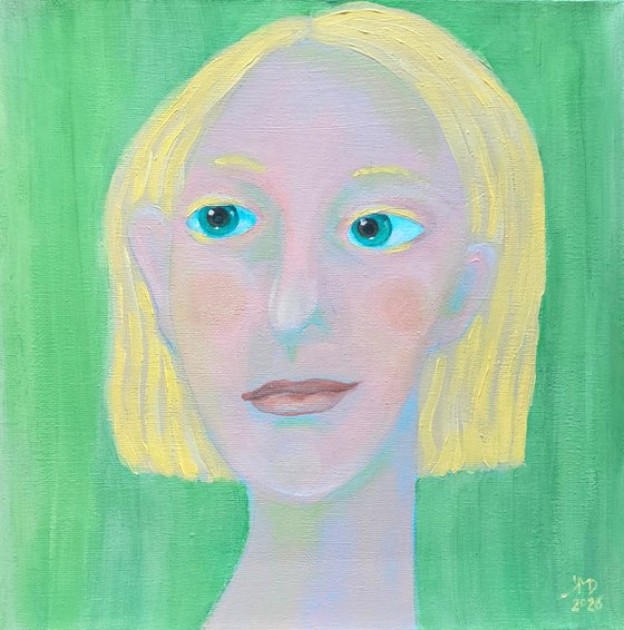 Young and blond soft green woman portrait