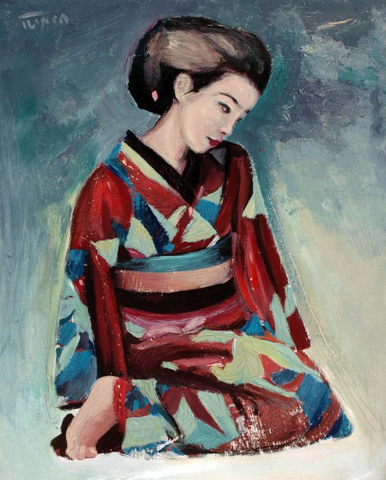 Geisha woman sitting on the floor