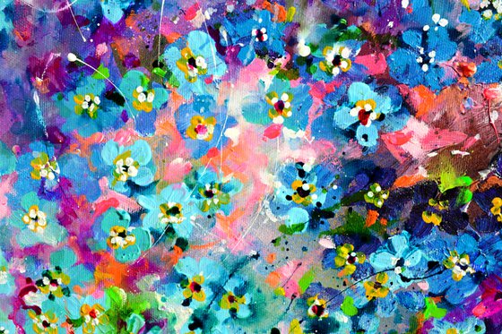 Forget me not flower field at sunrise