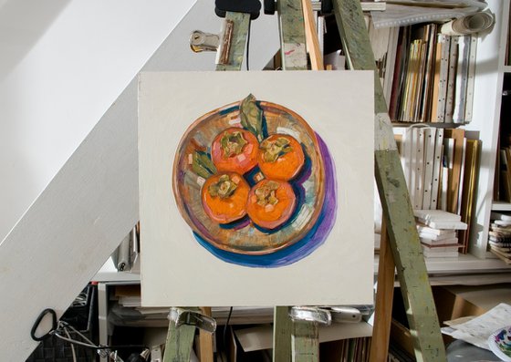 persimons in a plate