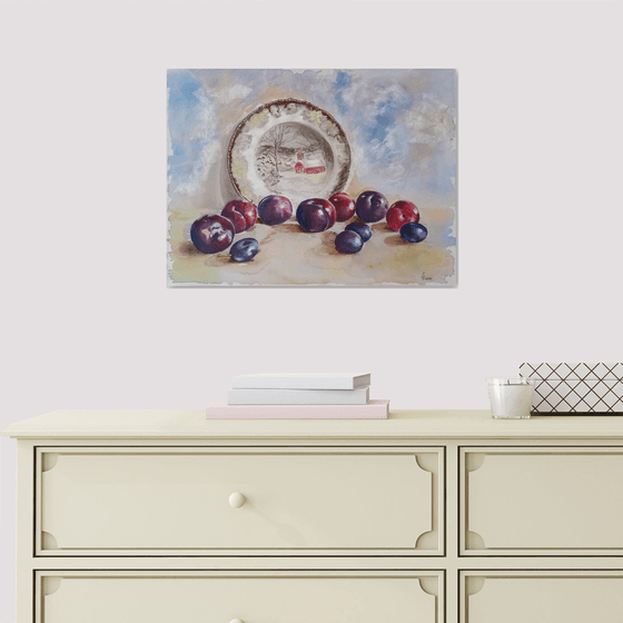 Plums rolled across the table