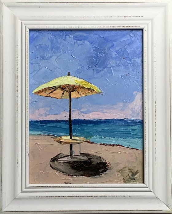 Yellow parasol on the Beach.