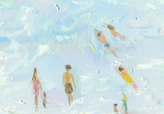 Summer day on the beach - swimming and sunbathing in the sea