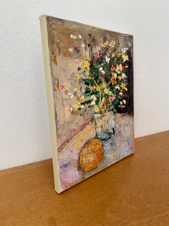 Still life with flowers and orange