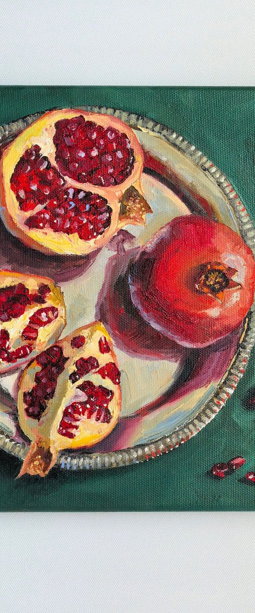 Pomegranates on metal tray by Leyla Demir