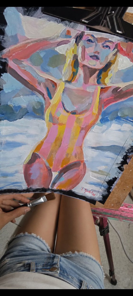 Girl in a Striped Swimsuit On the beach