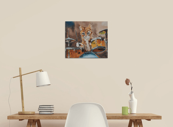 Cat plays drums