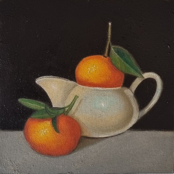 Oranges in Milk jug