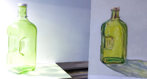 green bottle on a light background
